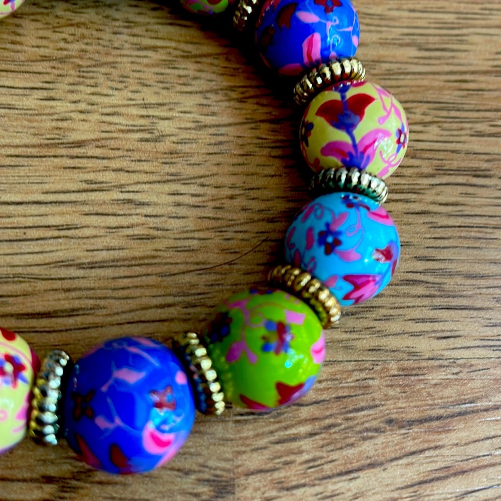Angela Moore stretch bracelet in blue green with flowers